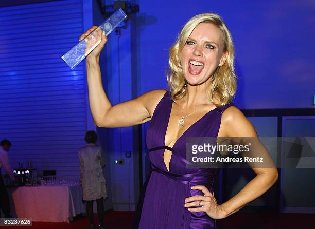 Actress Veronica Ferres holds up the award during the after show party to the German TV award at the Coloneum on October 11, 2008 in Cologne,...
