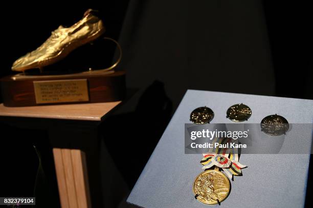 Competition medals and commemorative items are displayed on stage during the funeral service for Betty Cuthbert at Mandurah Performing Arts Centre on...