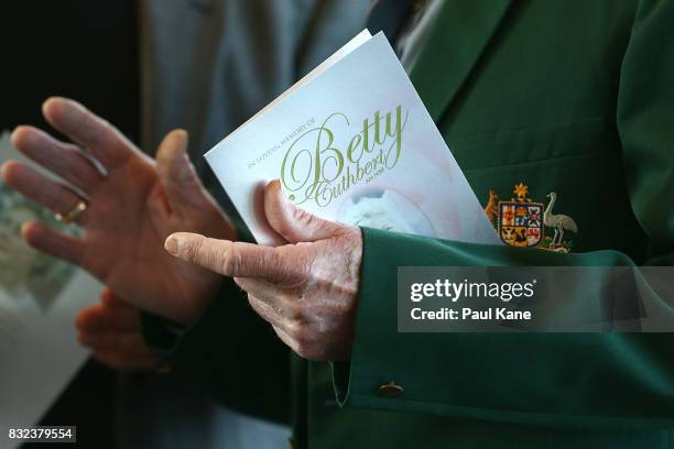 Mourner holds a copy of the Order of Service during the funeral service for Betty Cuthbert at Mandurah Performing Arts Centre on August 16, 2017 in...