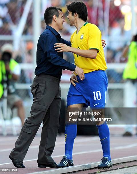 Brazilian player Kaka celebrates with team coach Dunga after making a goal against Venezuela on October 12 during their FIFA World Cup South Africa...
