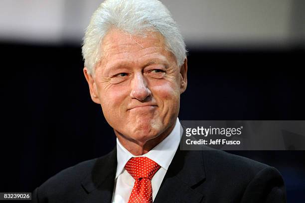 Former US President Bill Clinton pauses while speaking at a rally in support of Democratic presidential nomineee U.S. Sen. Barack Obama October 12,...
