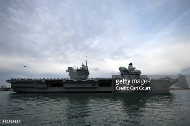 Queen Elizabeth sails into her home port of Portsmouth Naval Base on August 16, 2017 in Portsmouth, England. HMS Queen Elizabeth is the lead ship in...