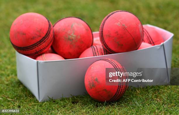 Box of used pink cricket balls are pictured on the pitch on the eve of the first day of the first cricket Test Match between England and the West...
