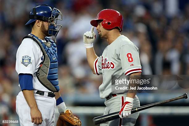 Shane Victorino of the Philadelphia Phillies gets in the face of catcher Russell Martin of the Los Angeles Dodgers after being thrown an inside pitch...