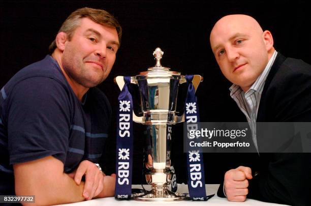 Ex Rugby International players Jason Leonard and Keith Wood posing for a photograph with the RBS Six Nations Trophy on the 13th March, 2006.