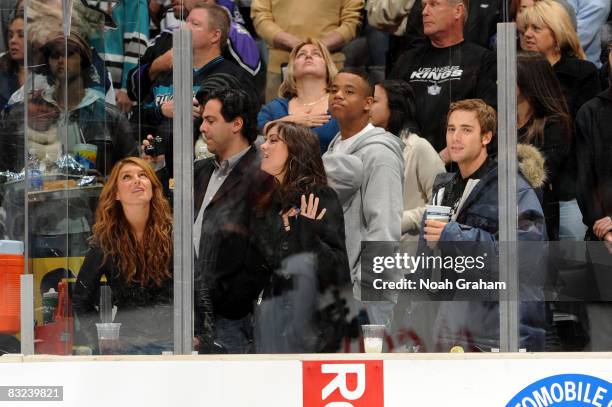 Actors Shenae Grimes, Jessica Stroup, Tristan Wilds, and Dustin Milligan attend the game between the San Jose Sharks and the Los Angeles Kings on...