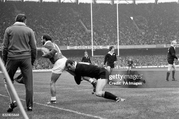 Wales's Clive Rees is tackled by New Zealand's Andy Haden