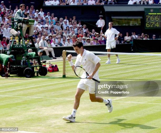 Tim Henman of Great Britain celebrates a point during his victory in the Men's Singles match against Todd Martin of the United States during the...