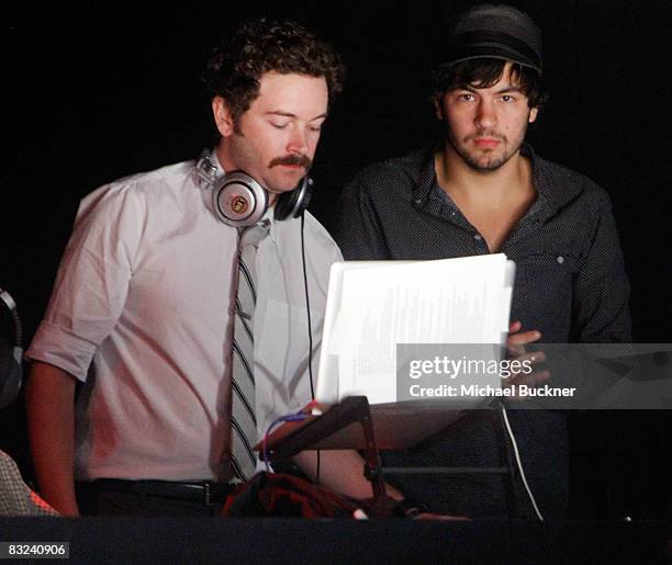 Actors Danny Masterson and Jordy Masterson mix the runway music at the Whitley Kros Spring 2009 fashion show during Mercedes-Benz Fashion Week held...