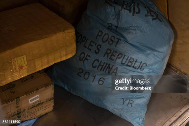 Mail sack marked "Post People's Republic Of China" sits inside the KLM Cargo center, operated by Air France-KLM Group, at Schiphol airport in...