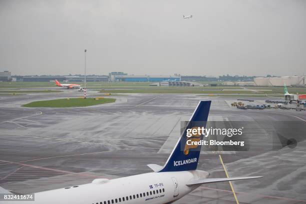 An Icelandair Group passenger plane stands on the tarmac at Schiphol airport in Amsterdam, Netherlands, on Tuesday, Aug. 15, 2017. Delta Air Lines...