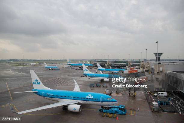 Passenger aircraft operated by KLM, the Dutch arm of Air France-KLM Group, stand on the tarmac at Schiphol airport in Amsterdam, Netherlands, on...