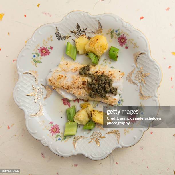 cod with salsa verde, celery and potatoes. - celery sticks stock pictures, royalty-free photos & images