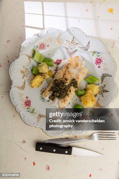 cod with salsa verde, celery and potatoes. - celery sticks stock pictures, royalty-free photos & images