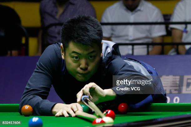 Liang Wenbo of China plays a shot during a qualifying match against Ian Burns of England on day one of Evergrande 2017 World Snooker China Champion...