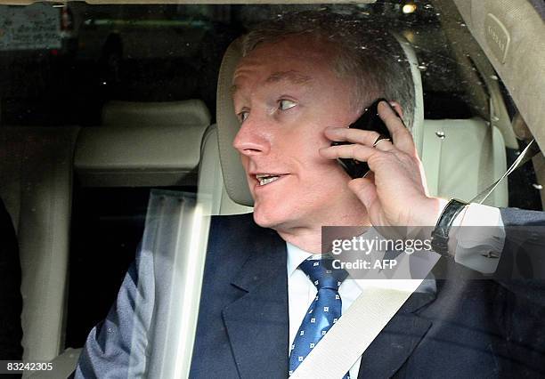 Sir Fred Goodwin, Chief-Executive Officer of the Royal Bank of Scotland, speaks on his mobile phone as he leaves the Edinburgh International...