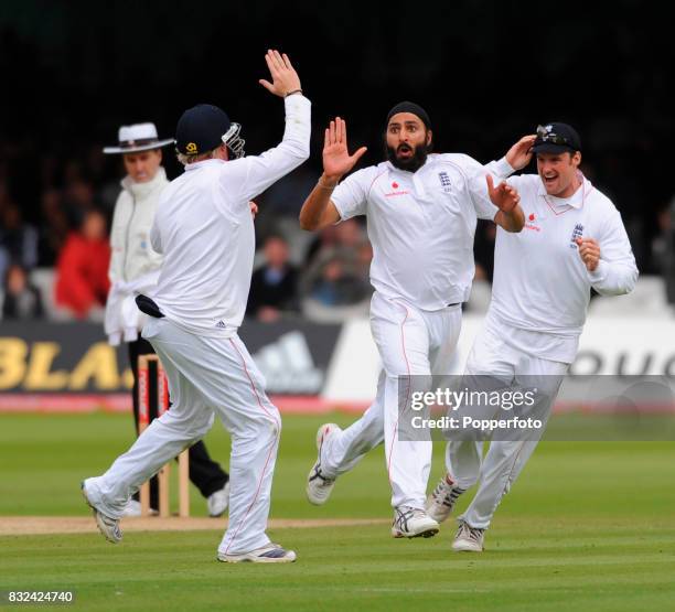 Monty Panesar of England celebrates with his teammates after bowling Neil McKenzie of South Africa during day three of the First Test match between...