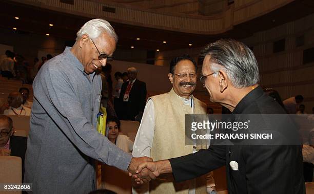 Indian Home Minister Shivraj Patil shakes hands with Jammu & Kashmir Governor N. N. Vohra during the 14th meeting of the National Integration Council...