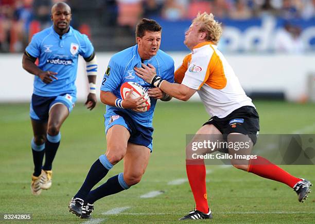 Derick Kuln is tackled by Adriaan Strauss in action during the Absa Currie Cup semi final match between Blue Bulls and Cheetahs held at Loftus...