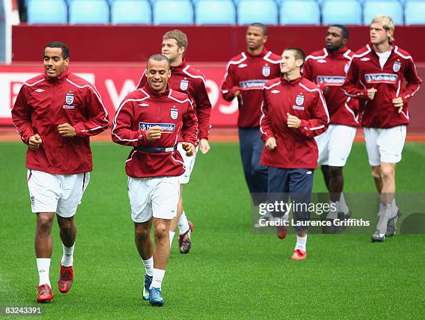 Gabriel Agbonlahor and Tom Huddlestone of England lead the warm up during a training session at Villa Park on October 13, 2008 in Birmingham, England.