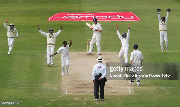 Muttiah Muralitharan of Sri Lanka appeals sucessfully for the wicket of England batsman Andrew Flintoff, caught by Tillakaratne Dilshan for 0, during...