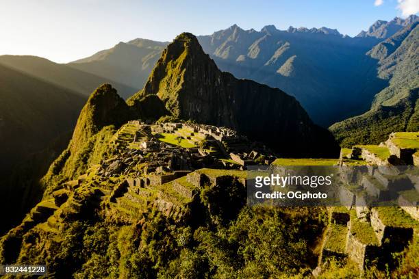 view of machu picchu as seen from agricultural terraces - ogphoto stock pictures, royalty-free photos & images