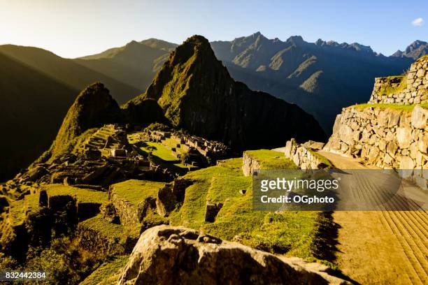 view of machu picchu as seen from agricultural terraces - ogphoto stock pictures, royalty-free photos & images