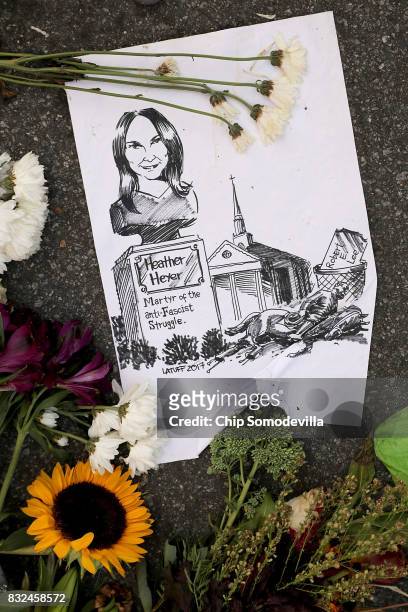Sketch calling for a park to be renamed after Heather Heyer lays in the street where she was killed and 19 others injured when a car slamed into a...