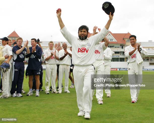 Mushtaq Ahmed of Sussex celebrates after Sussex secured the Liverpool Victoria County Championship by winning the County Championship match between...