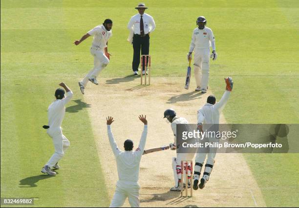 England's Monty Panesar celebrates after having Sri Lanka batsman Upul Tharanga caught by wicketkeeper Geraint Jones for 52 runs during the 1st Test...