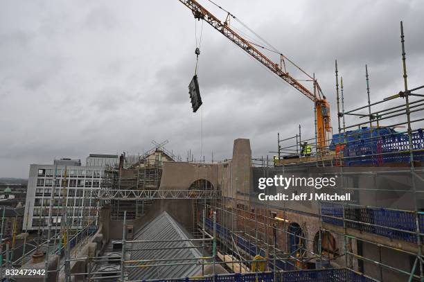 The iconic Hen Run wall and roof panels are craned in at the Glasgow School of Art Mackintosh building on August 16, 2017 in Glasgow, Scotland....