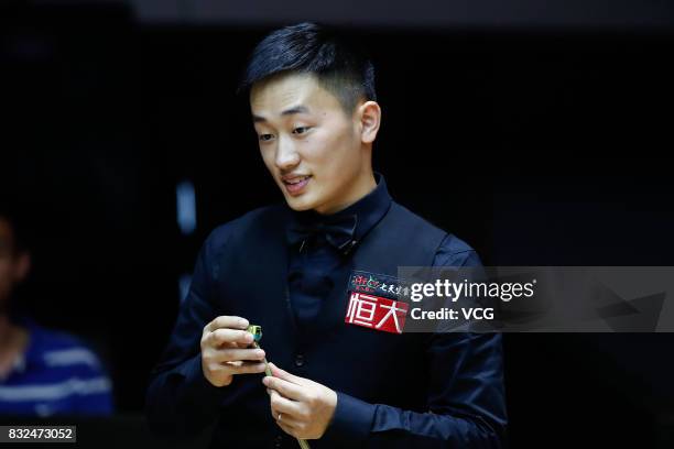 Niu Zhuang of China reacts during a qualifying match against Ding Junhui of China on day one of Evergrande 2017 World Snooker China Champion at...