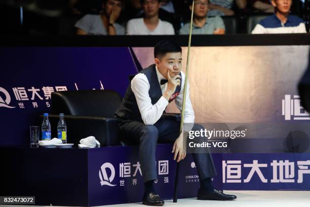 Ding Junhui of China reacts during a qualifying match against Niu Zhuang of China on day one of Evergrande 2017 World Snooker China Champion at...