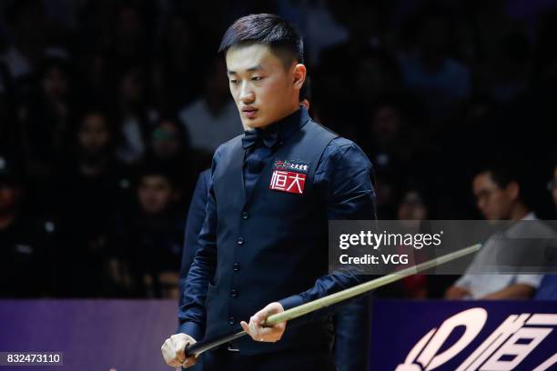 Niu Zhuang of China reacts during a qualifying match against Ding Junhui of China on day one of Evergrande 2017 World Snooker China Champion at...