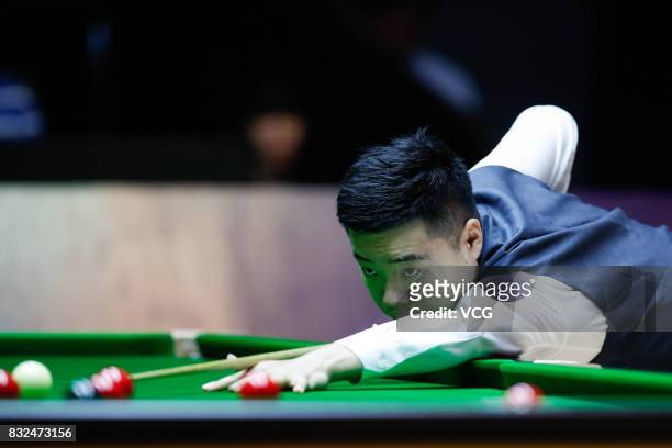 Ding Junhui of China plays a shot during a qualifying match against Niu Zhuang of China on day one of Evergrande 2017 World Snooker China Champion at...
