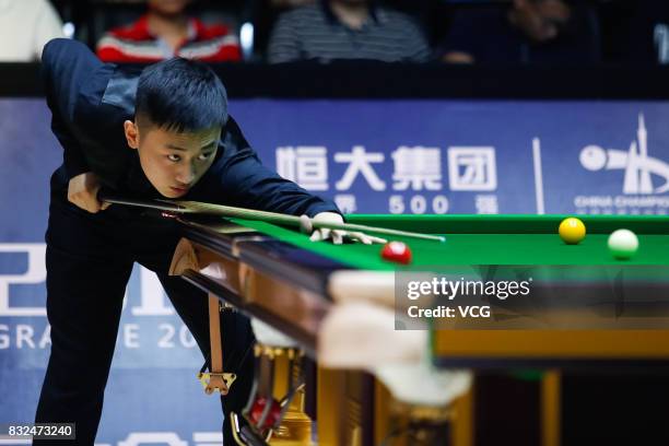 Niu Zhuang of China plays a shot during a qualifying match against Ding Junhui of China on day one of Evergrande 2017 World Snooker China Champion at...