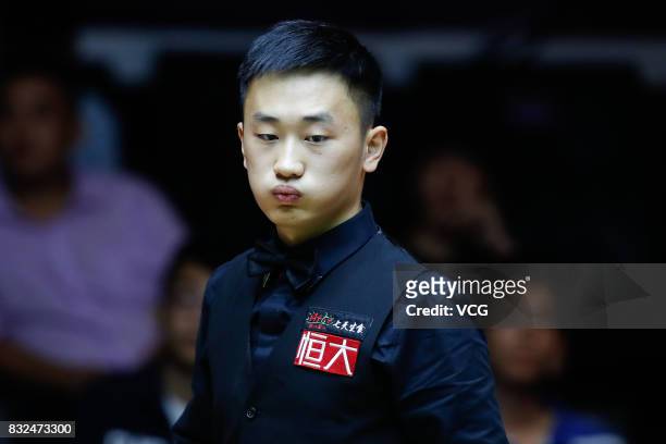 Niu Zhuang of China reacts during a qualifying match against Ding Junhui of China on day one of Evergrande 2017 World Snooker China Champion at...