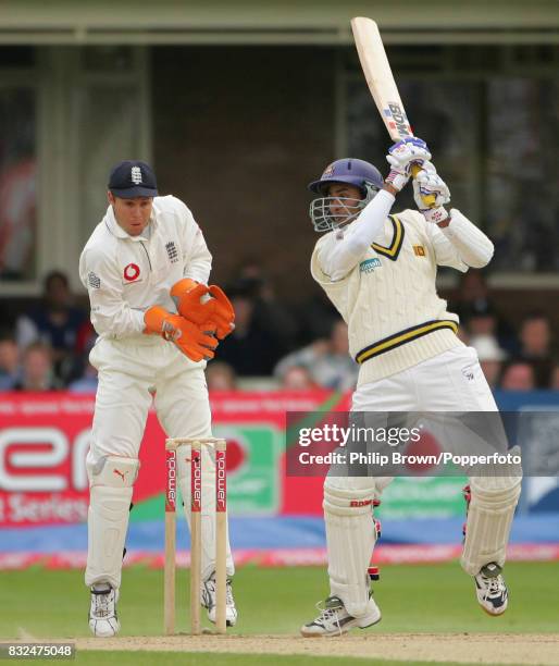 Tillakaratne Dilshan batting for Sri Lanka during his innings of 59 runs watched by England wicketkeeper Geraint Jones in the 2nd Test match between...