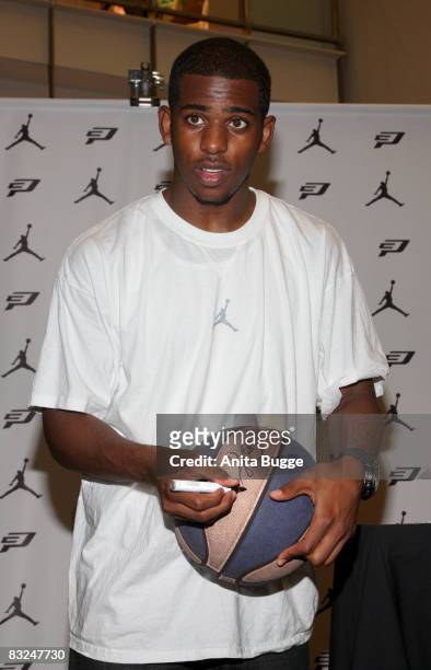 Player New Orleans Hornets point guard Chris Paul signs autographs during an instore appearance at the Niketown store on October 13, 2008 in Berlin,...