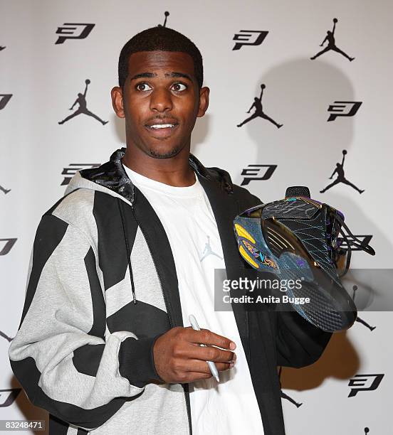 Player New Orleans Hornets point guard Chris Paul puts his signature on the "Air Jordan CP3 signature shoes" during an instore appearance at the...