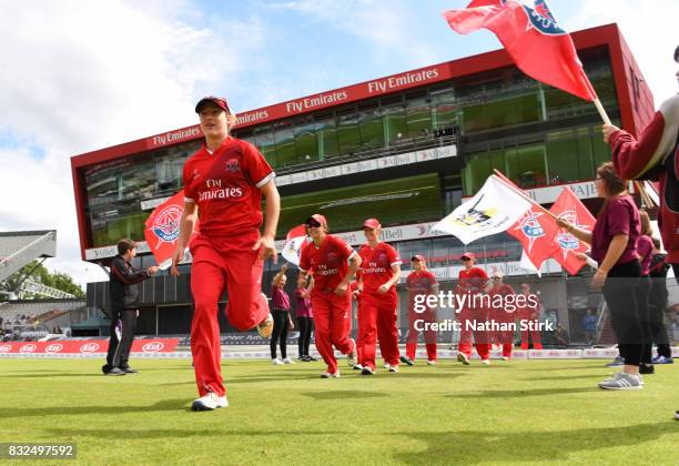 Emma Lamb of Lancashire Thunder runs onto the playing field during the Kia Super League 2017 match between Lancashire Thunder and Surrey Stars at Old...