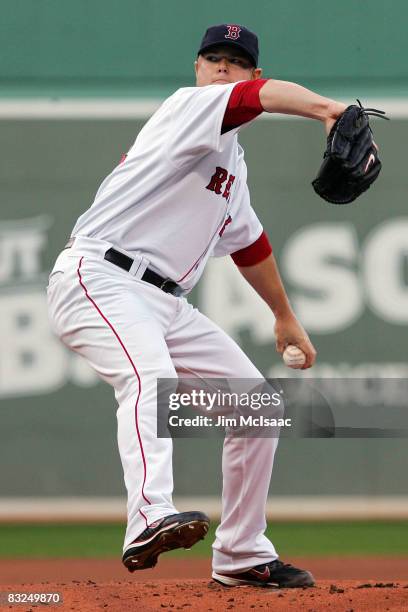 Starting pitcher Jon Lester of the Boston Red Sox deals against the Tampa Bay Rays in game three of the American League Championship Series during...