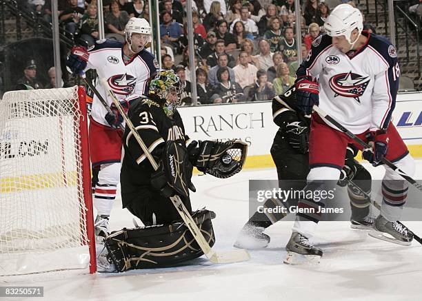 Marty Turco of the Dallas Stars makes a glove save against R.J. Umberger of the Columbus Blue Jackets on October 10, 2008 at the American Airlines...