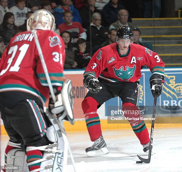 Adam Brown and Tyler Myers of the Kelowna Rockets defend the net against the Prince George Cougars at Prospera Place on October 11 in Kelowna,...