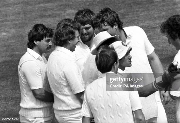 England players cluster round Eddie Hemmings to shower him with congratulations after he had taken his first Test wicket. With only his 4th ball he...