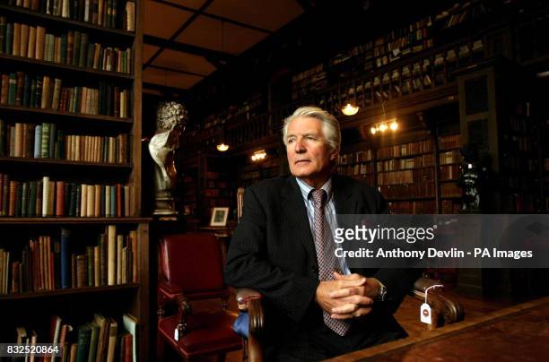 Lord Coleridge poses in the library at The Chanter's House.