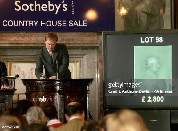 Auctioneer Harry Dalmeny accepts the highest bid of 3,360 for Lot 98, a portrait drawing of William Wordworth after Leonard Charles Wyon, in today's...
