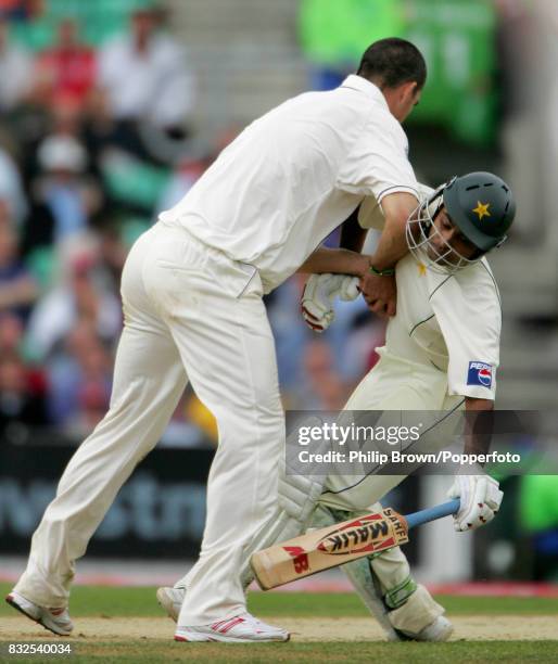 England bowler Kevin Pietersen collides with Pakistan batsman Mohammad Hafeez in trying to field the ball during the 4th Test match between England...