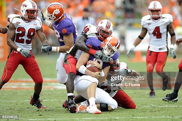 Moise Fokou of the Maryland Terrapins sacks Cullen Harper of the Clemson Tigers at Memorial Stadium on September 27, 2008 in Clemson, South Carolina....