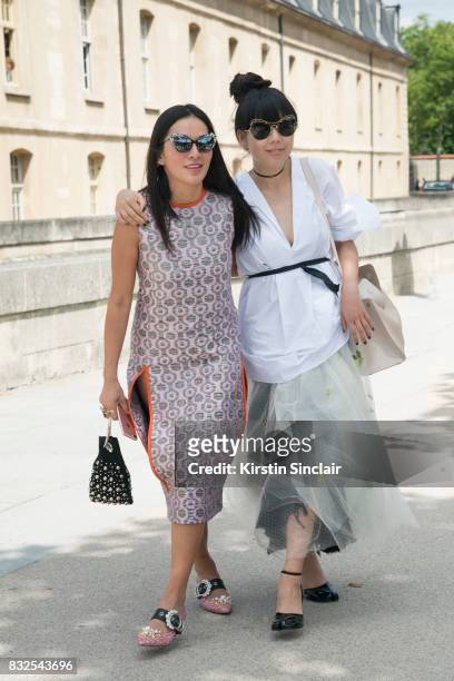 Fashion stylist Tina Leung wears a Marni dress, Miu Miu shoes, Delphine Delafon bag and Prism sunglasses with Fashion writer Susanna Lau wearing all...
